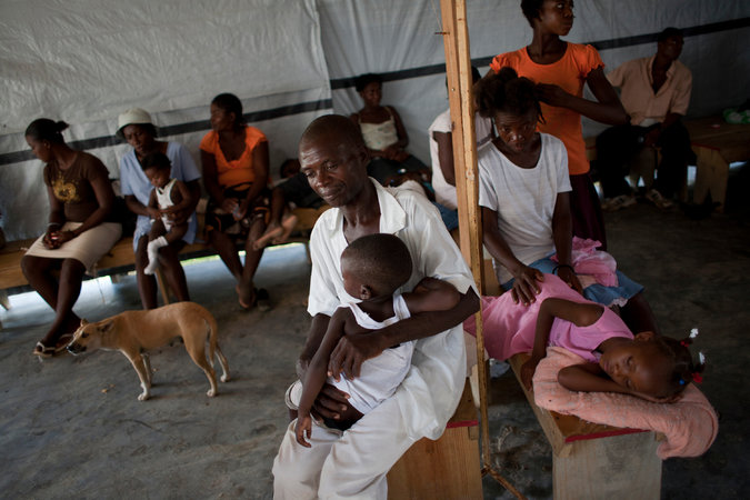 Haitians in a cholera treatment center in 2011. Credit Andres Martinez Casares for The New York Times.