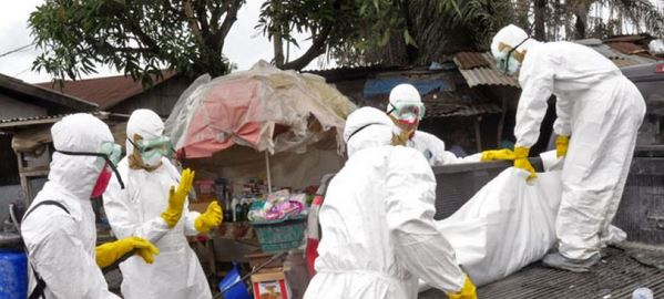 Sept. 10, 2014: Health workers load the body of a woman they suspect died from the Ebola virus onto a truck in Monrovia, Liberia. (AP)