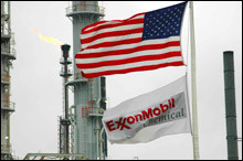 ExxonMobil's flag flies near an oil refinery.