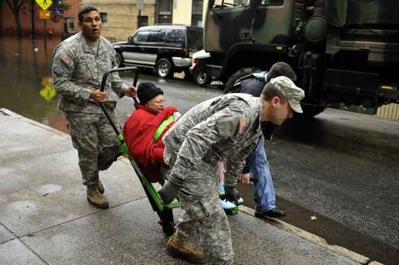 Members of the Army National Guard Unit Gulf 250 from Morristown, NJ evacuate a victim from Hurricane Sandy on October 31, 2012 in Hoboken, New Jersey. (Getty)