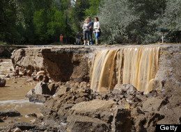 Local residents look at the damage along Topaz Street September 13, 2013 in Boulder, Colorado. (Photo by Marc Piscotty/Getty Images) 