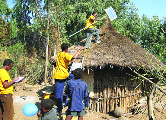 Installing solar panels in a village.
